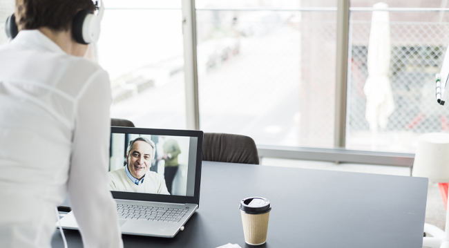 man on video call in office